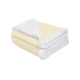 Folded beige luxury baby blanket showing thick plush top and cozy sherpa lining for warmth and comfort.
