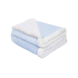 Folded blue luxury baby blanket showing thick plush top and cozy sherpa lining for warmth and comfort.
